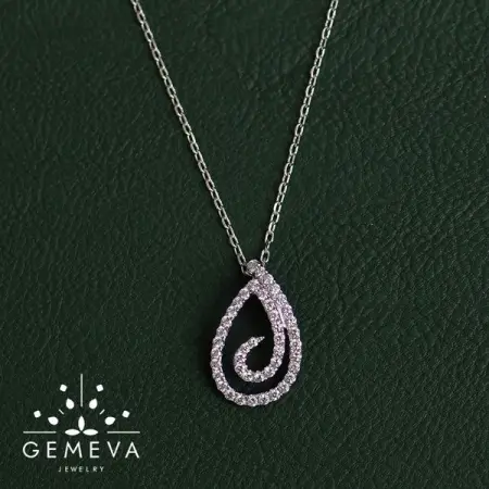 Graceful twirling 18K Gold and Diamond pendant.
Details Gold 3.75 Gm  Dia