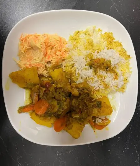 Curry chicken Jamaican style  with white rice and home coleslaw. Recipe out on YouTub