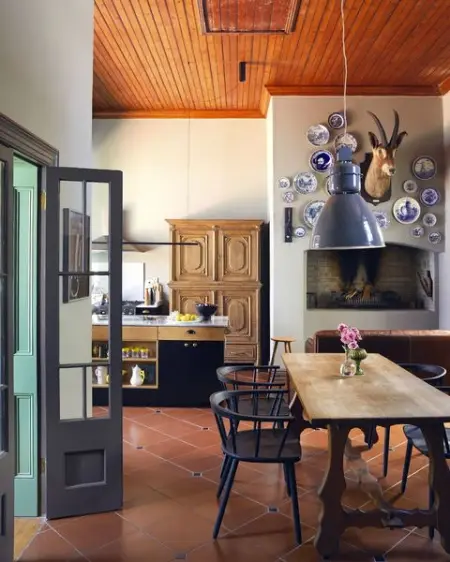 Reclaimed, secondhand finds, like an antique french oak cabinet and a kitchen table f