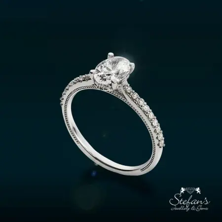STEFANSJEWELLERY.COM
Uniquely Designed
Solitaire ring paved with little d