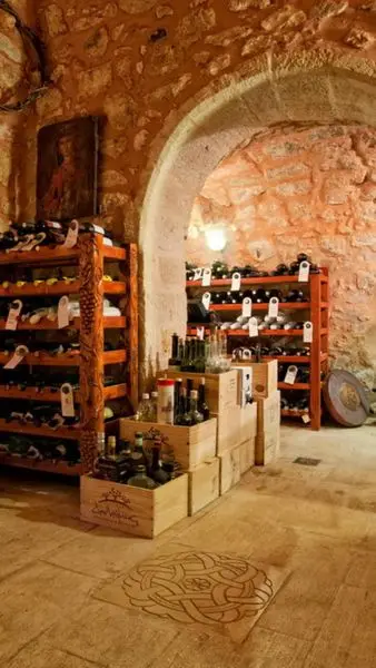 More than 150 wine labels are hosted in a 600 year old stone, built cellar, on the g