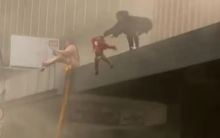 A two-year-old girl survived unharmed after her mother threw her to safety as 