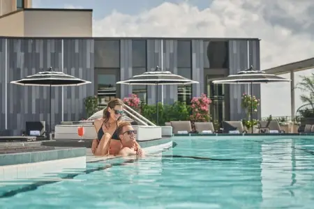 Experience a riverfront resort-style pool, sophisticated dining and luxury rooms