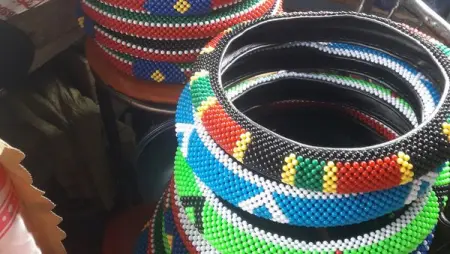 We are dealers in beaded bangles and bracelets, key holders, steering covers, masai shoe