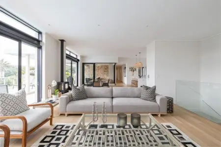 Our open plan living, dining and kitchen area opens up onto a crystal clear p