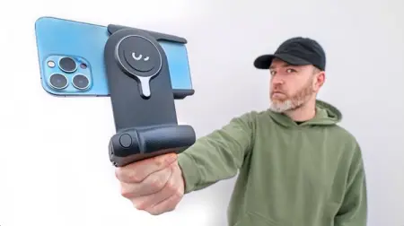 A wireless charging camera grip for your mobile phone that turns it into a p