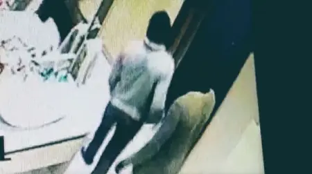 The video shows two men sneaking around a house, moving the cameras as they n